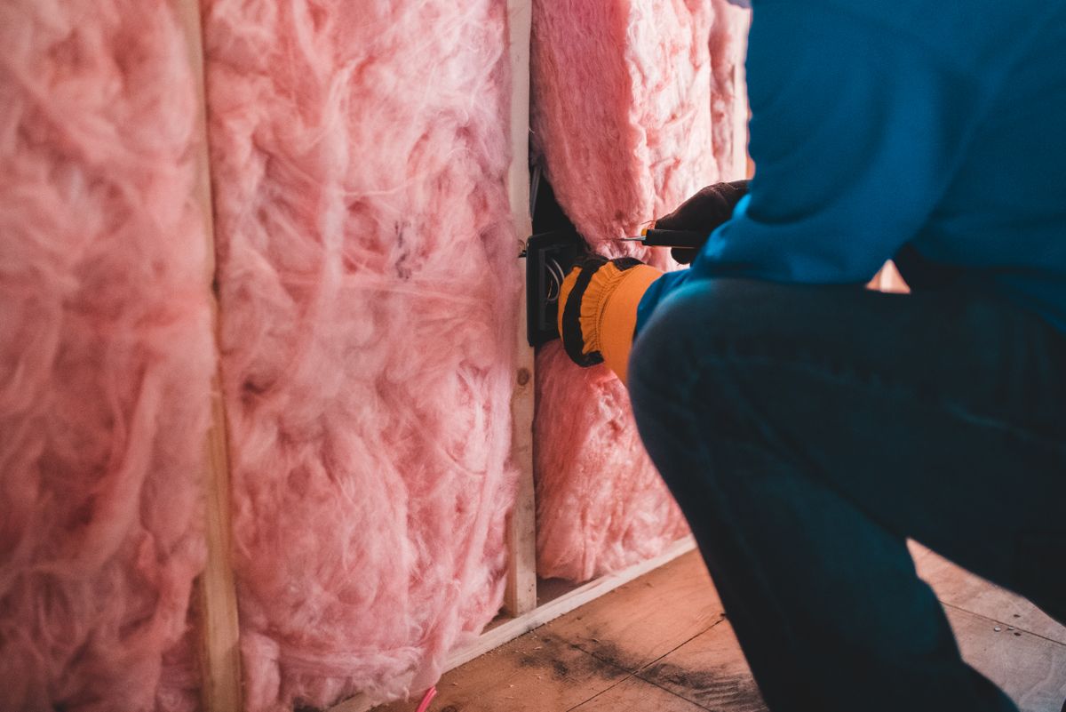 HVAC Homes PRO technician servicing a heating and cooling unit